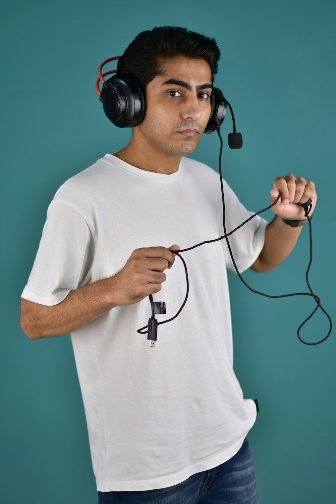 Studio portrait of a Finnish male broadcast production instructor in his 40s wearing a headset